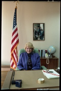 Margaret Heckler, United States Ambassador to Ireland, seated at a desk in her office