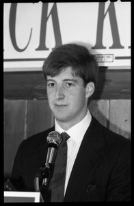 Patrick Kennedy campaign breakfast of ham and eggs at Caruso's Restaurant: close-up of Kennedy speaking at the podium beneath a sign reading 'Welcome to breakfast with Patrick Kennedy'