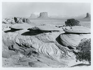 Three hats and several buttes