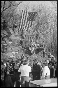 Crowd greeting the Iran hostages at Highland Falls, N.Y., American flag hanging high from trees