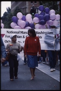 Newly-elected Congressional Representative Nancy Pelosi (red sweater) marching in the San Francisco Pride Parade in front of a banner for the National March on Washington for Lesbian and Gay Rights