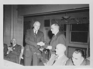 Ralph Van Meter presenting Willard Munson and award on the occasion of his retirement