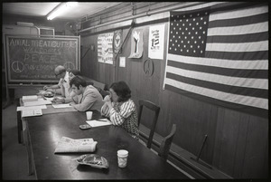 Student Mobilization Committee to End the War in Vietnam meeting against SDS violence: view of speakers with chalkboard behind reading "Amal. Meatcutters welcomes peace movements"