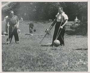 Men with crutches play ball