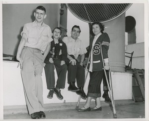 Group of young people relaxing on sun deck