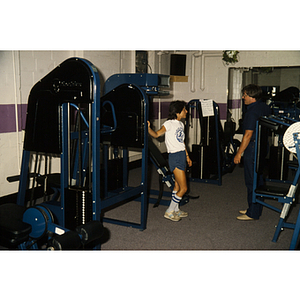 Man and women talk in a gym