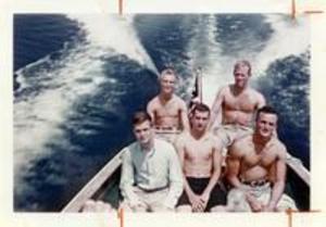Members of Class of 1958 on motorboat