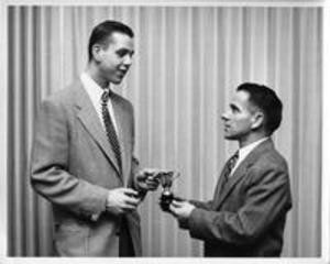 Ralph Townsend accepts trophy, 1958