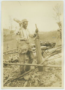 Black man splitting wood in Virginia