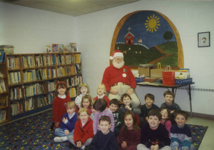 Santa reading to students at Old Cole School