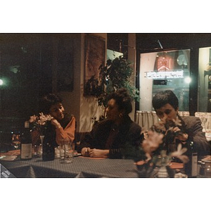 Richard Thal, Inquilinos Boricuas en Acción's Assistant Director, (right) and others at a restaurant.