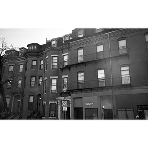 Exterior of brick buildings, including one with a plaque that reads, "ETC Meeting Room."