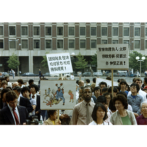 Demonstrators at a rally for Long Guang Huang at City Hall Plaza in Boston