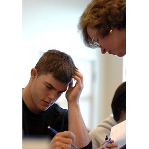 The professor leans over Joseph Bordieri in class