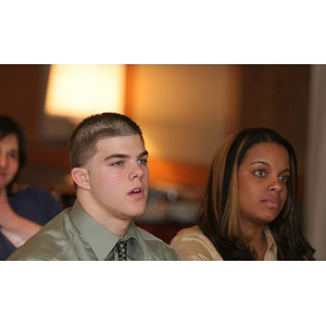 Joseph Bordieri and Ana Hidalgo sit in the audience at a Torch Scholars event