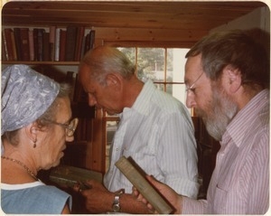 Sid Kaplan (center), Emma Nogrady Kaplan (left), and Leonard Basking perusing books at the Common Reader Bookshop