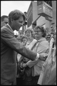Robert F. Kennedy shaking hands with the crowd during the Turkey Day festivities