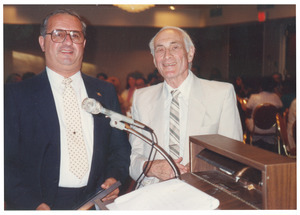 Sidney Lipshires (right) and unidentified man at dinner event