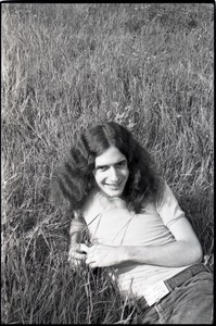 Informal portrait of Ron Cobleigh lying in the grass