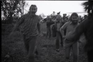 Communards running toward camera (blurry)