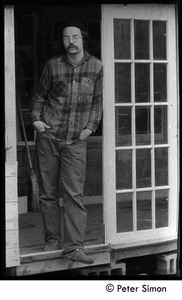 Bob Payne standing in a doorway, Montague Farm commune