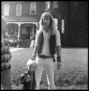 Michael Metlica and young boy in front of the Brotherhood of the Spirit commune house on Chestnut Street, Turners Falls