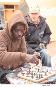 Occupy Baltimore: older man playing chess