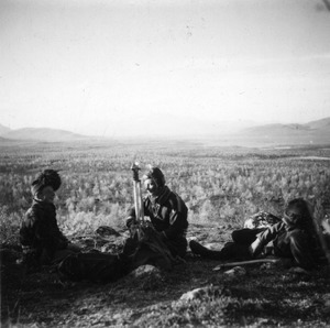 Three men in a field in Lapland