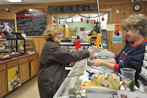 Sales transaction at the counter, New Salem General Store