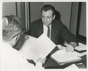 An instructor and trainee at TOWER clerical training