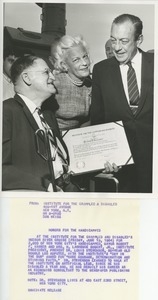 Dr. Stevenson being presented with an award by Mrs. H. Lawrence Bogert, Jr. and Mayor Robert F. Wagner