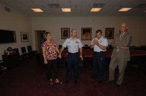 Congressman John W. Olver (far right) at ceremony appointing Commander Mark Fedor (center), US Coast Guard, as Special Detailee to House Appropriations Committee