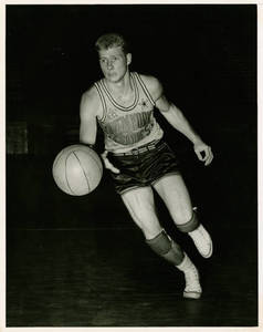 Joseph Lyles dribbling a basketball, ca. 1952
