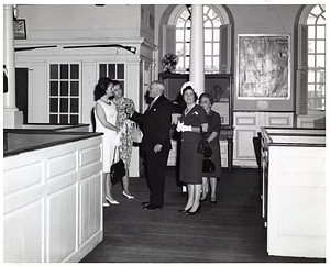 Two unidentified women; Mark Bortman, Chairman of the Civic Committee of the People-to-People Program; Mary Collins; and Llora Bortman inside the Old South Meeting House