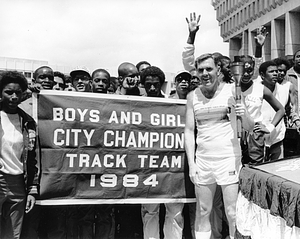 Mayor Raymond L. Flynn participating in Olympic torch relay with members of Boys and Girls City Champion Track Team