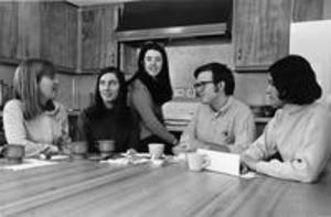 Female transfer students and a male student talking in Lambert House, 1970
