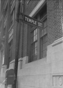 View of the Temple Street sign with the Archer Building (20 Derne Street) in the background