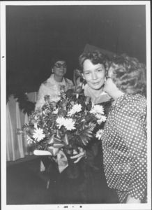 Graduate receiving flowers at the 1978 Suffolk University commencement