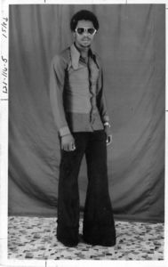 Abdulas Barrie of Suffolk University's International Studies Association, wearing sunglasses and bell bottoms, 1978