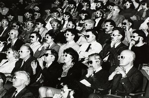 Theater audience wearing 3-d glasses
