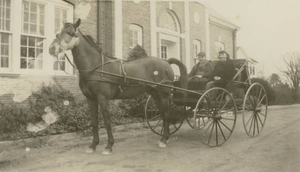 My neighbors with their horse and buggy in front of bank in Norwell Center