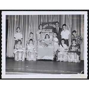 Group portrait of the Little Sister Contest winners with their brothers and two judges, including Richard Harte, Jr., at right
