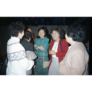 Suzanne Lee and other members of the Chinese Progressive Association chat after a class at the University of Massachusetts at Boston