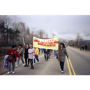 Women from the Chinese Progressive Association Workers' Center march in the International Paper Company strike