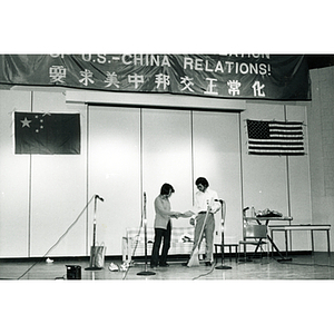 Performers in a theatrical sketch onstage at the Josiah Quincy School about the normalization of U.S. and China relations