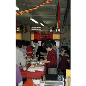 Guests eating at an International Women's Day event