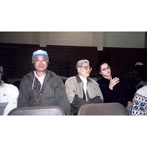 Chinese Progressive Association members sit waiting for a meeting to begin