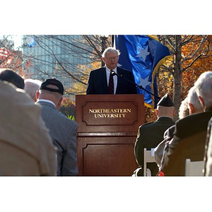 Neal Finnegan at the podium at the Veterans Memorial dedication ceremony