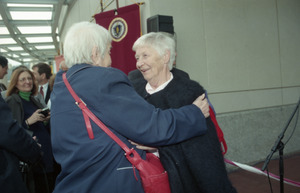 Dedication ceremonies for the Conte Polymer Center: Corinne Conte greeted by an acquaintance