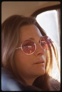 Judy Collins: portrait in rose-colored glasses, seated in the back of car